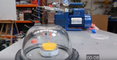 Spinning Top in a Vacuum Chamber