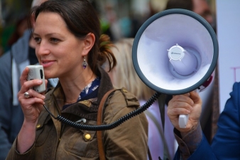 A picture of a woman using a megaphone
