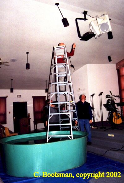 Funny Pictures of Stepladder in Baptismal Tank