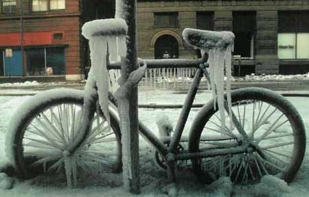 Funny Pictures of Bicycle Frozen and Locked to Pole.