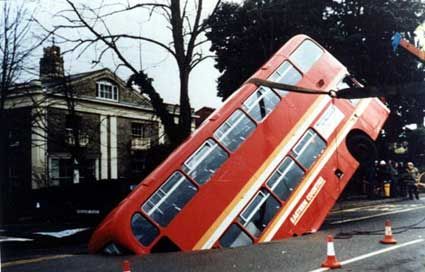 Funny Pictures of Double Decker Bus in Sink Hole