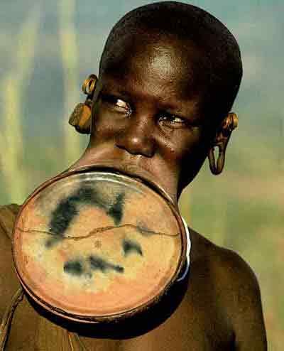Funny Pictures of Man with Disc in Top Lip
