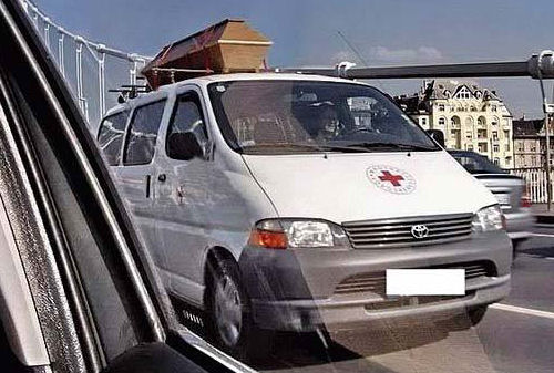 Funny Pictures of Casket on Red Cross Vehicle