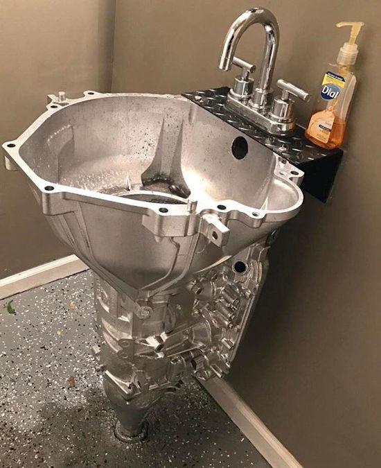 A bathroom sink made from a transmission housing
