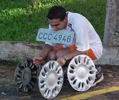 Funny Pictures of Teen with Hub Caps and License Plate