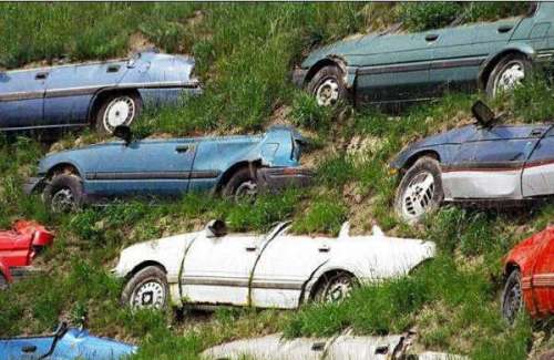 Funny Pictures of Junk Cars Buried in Hill