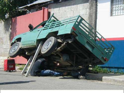 Funny Pictures of Truck Propped on 2 by 4s