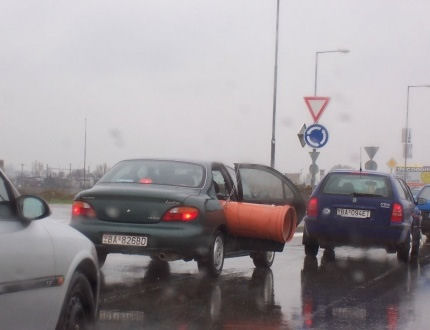 Funny Pictures of Pipe Sticking Out of Car