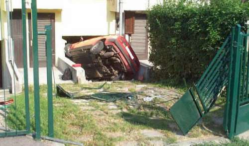 Funny Pictures of Car Crashed Into House