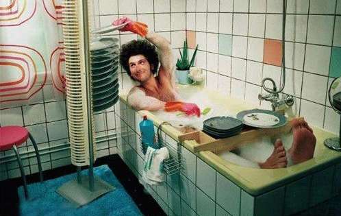 Funny Pictures of Guy Washing Dishes in Bath
