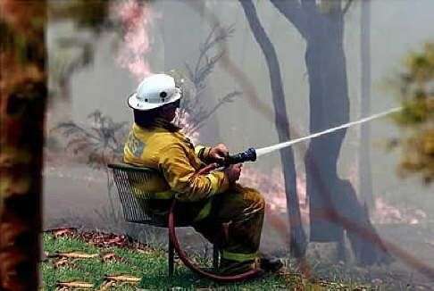 Fireman Sitting In Lawn Chair