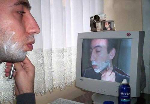 Man Shaving With Web Cam