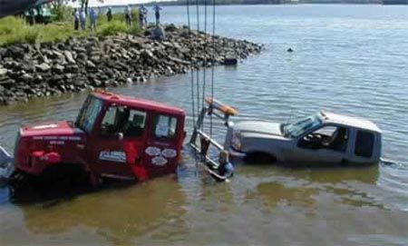 Funny Pictures of Tow Truck Half Submerged in Water.