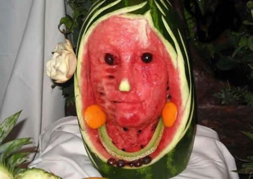 A picture of a face carved into a watermelon