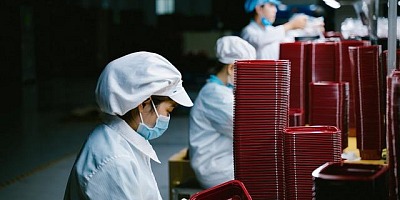 Factory workers in a production line.