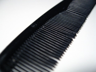 A close-up of a man's black comb.