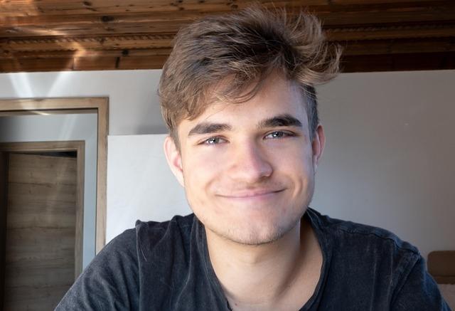 A teen-aged boy with a big smile.