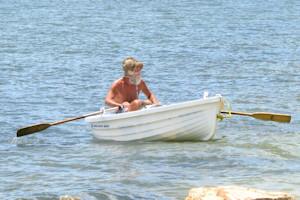 rowing a row boat.