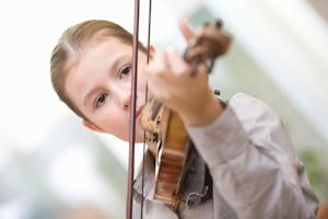 Mother pride in son's ability to play violin