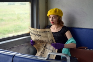 woman newspaper train