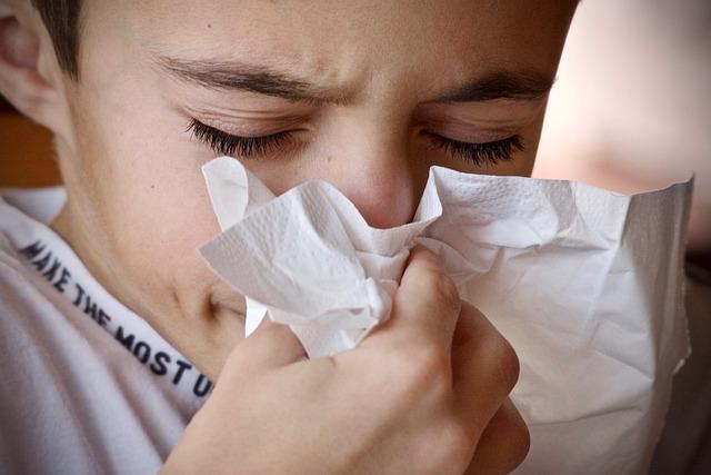 woman sneeze cold