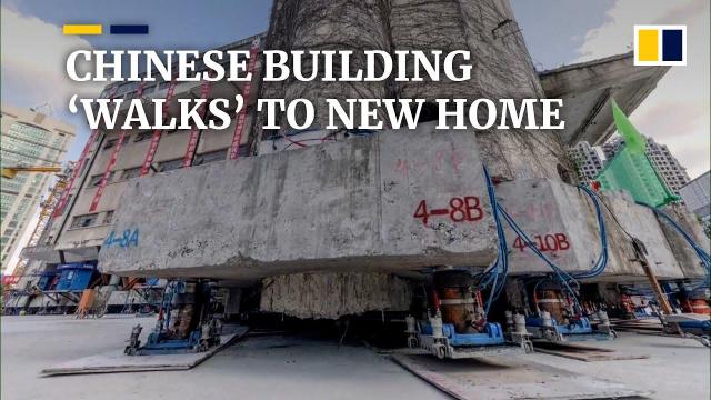 chinese building walks to new home