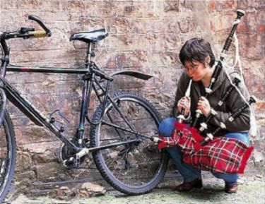 Funny Pictures of Bike Tire Being Pumped By Bagpipes