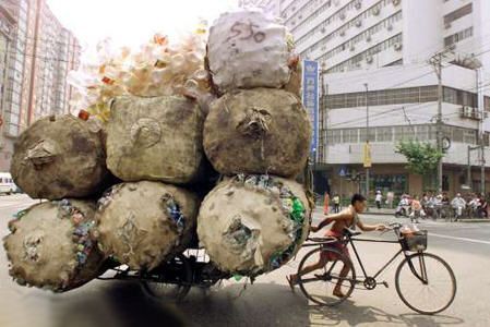 Funny Pictures of Bicycle Pulling Recycled Plastic