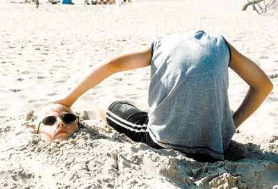 Funny Pictures of Boy At Beach With No Head