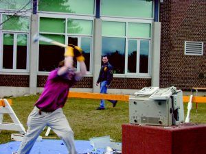 Funny Pictures of Man Batting a Computer