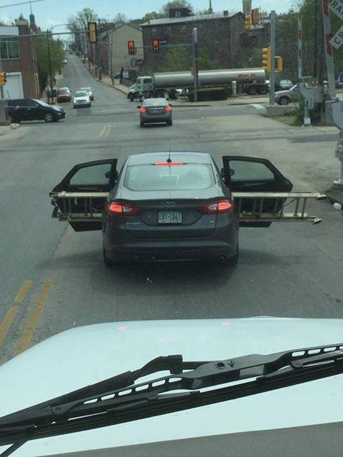 Funny picture of a car transporting a ladder