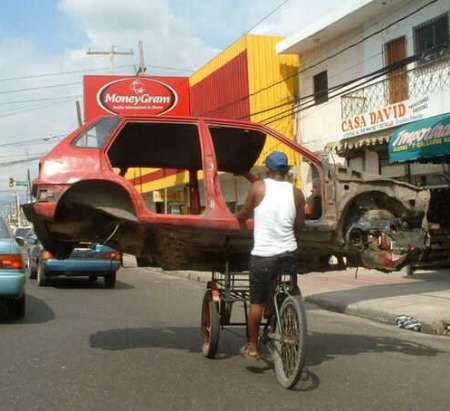 Funny Pictures of Bicycle Carrying Car Body