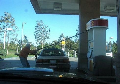 Funny Pictures of Guy At Self Serve Gas Pump