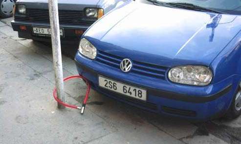 Funny Pictures of Car Padlocked to Pole