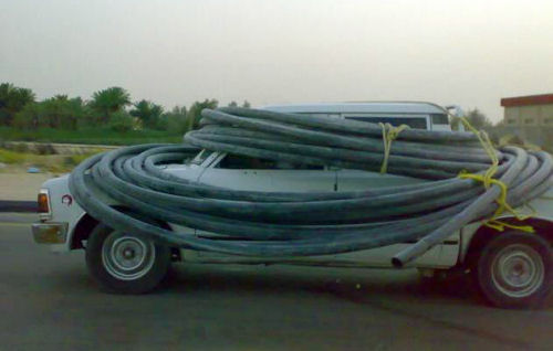 Funny Jokes Pictures of truck wrapped in pipe.
