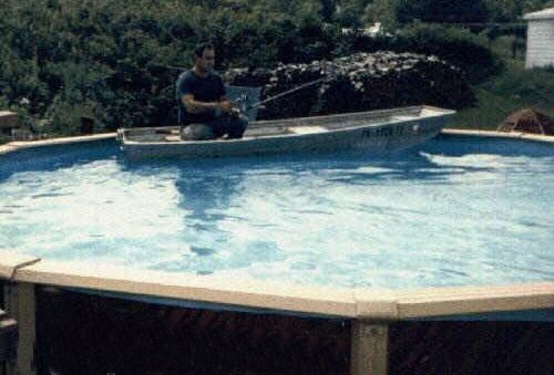 Funny Pictures of Man Fishing In Pool