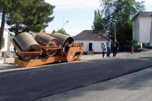 Funny Pictures of Pavement Rollar Flipped Over
