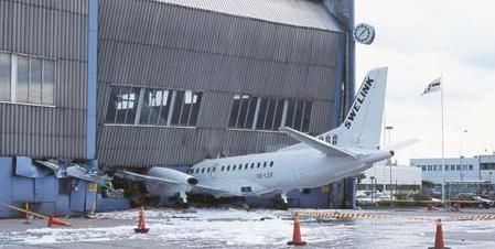 Funny Pictures of Garage Door Closing on Plane