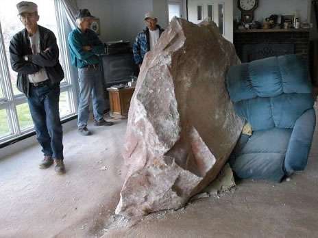 Funny Pictures of Big Rock Blasted Into House