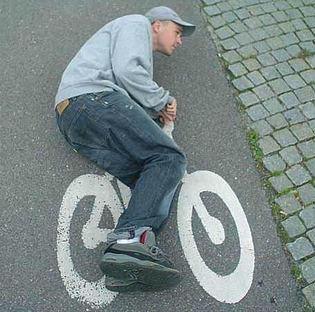 Funny Pictures of Kid Riding Bike Lane Sign