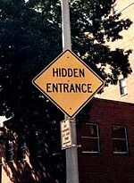 Funny Pictures of Hidden Entrance Sign.