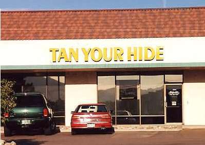 Funny Pictures of Tan Your Hide Sign