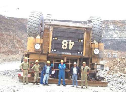 Funny Pictures of Hugh Dump Truck Flipped Upside Down
