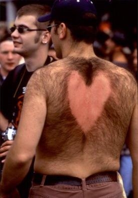 A picture of a Valentine heart chaeved into a guy's back.