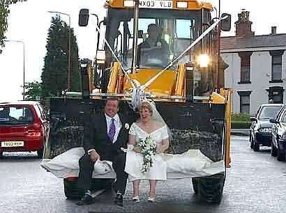 Funny Pictures of Bride and Groom in Tractor Bucket