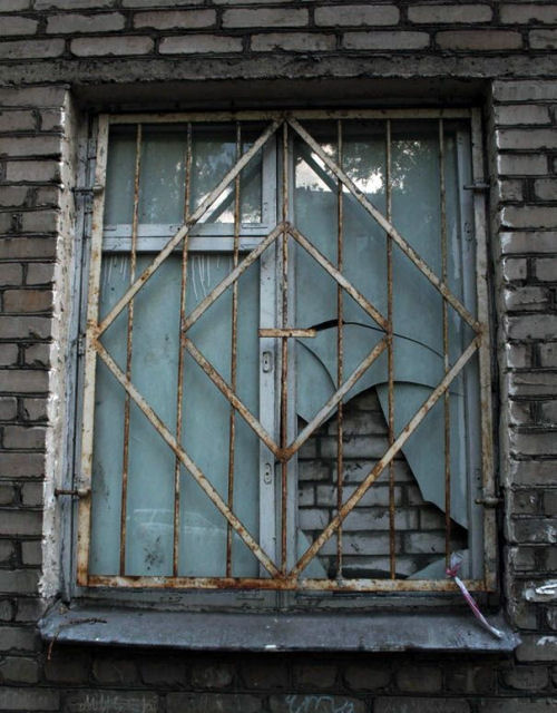 Funny Pictures of Barred and Bricked Window
