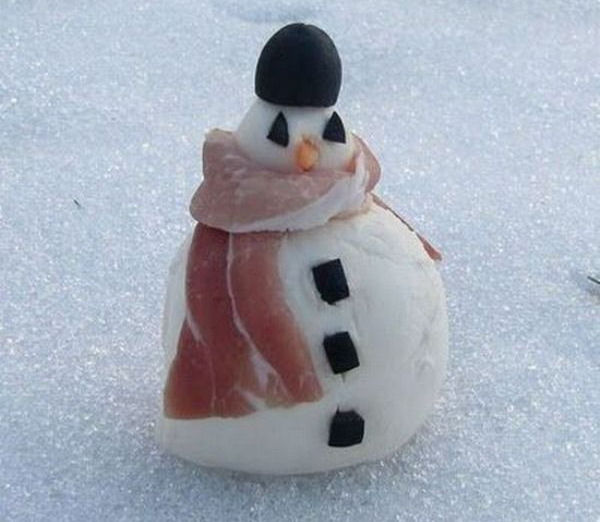 A snowman with a bacon scarf.