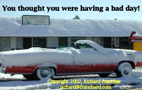 Funny Pictures of a Topless Convertable Covered in Snow