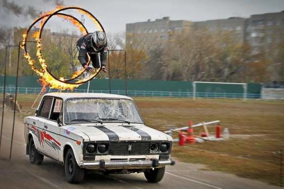 Jumping through a ring of fire on a car.