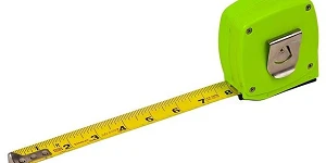 A green retractable tape measure on a plain white backdrop with the tape out to the 8 inch mark.